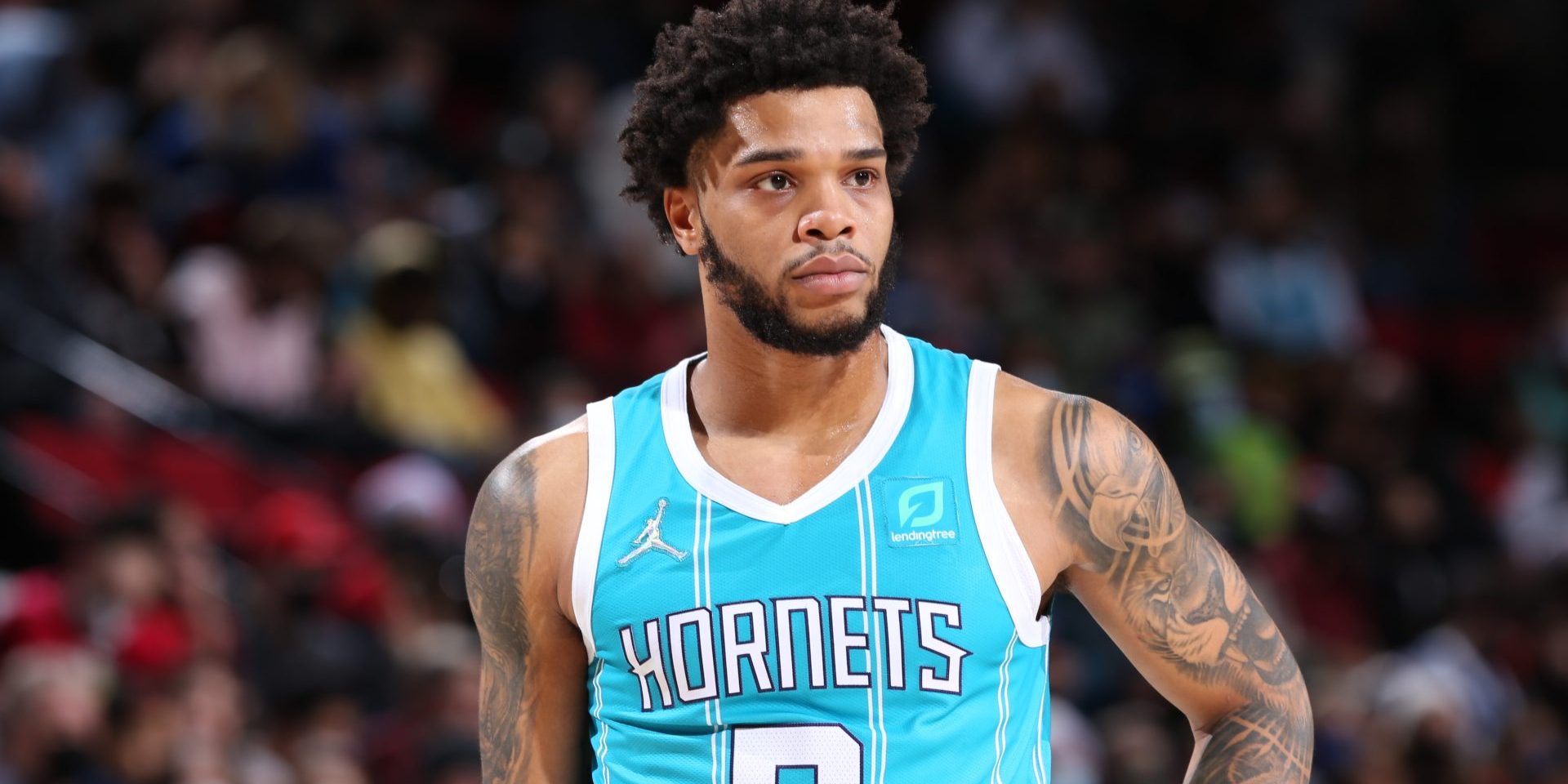PORTLAND, OR - DECEMBER 17: Miles Bridges #0 of the Charlotte Hornets looks on during the game against the Portland Trail Blazers on December 17, 2021 at the Moda Center Arena in Portland, Oregon. NOTE TO USER: User expressly acknowledges and agrees that, by downloading and or using this photograph, user is consenting to the terms and conditions of the Getty Images License Agreement. Mandatory Copyright Notice: Copyright 2021 NBAE (Photo by Sam Forencich/NBAE via Getty Images)